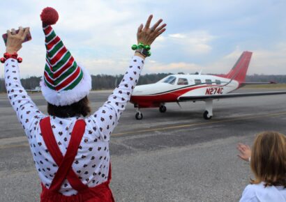 Area Children Greet Santa and Mrs. Clause as They Fly in To Prattville