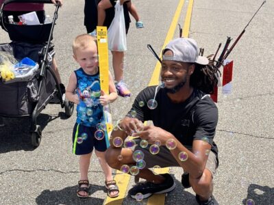 Prattville citizen, Marcus Thomas, gives fishing poles and boxing gloves to kids