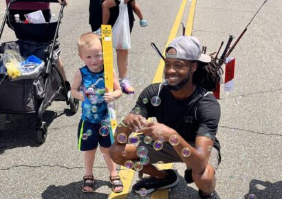 Prattville citizen, Marcus Thomas, gives fishing poles and boxing gloves to kids