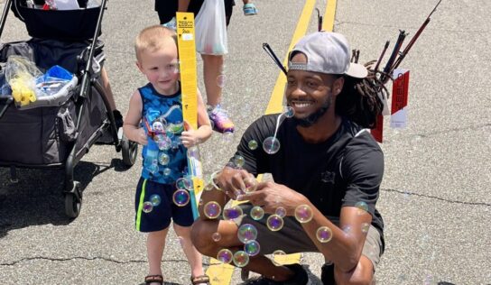 Prattville citizen, Marcus Thomas, gives fishing poles and boxing gloves to kids