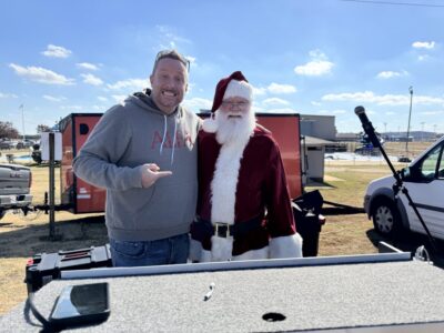 Hundreds gather to welcome skydiving Santa and Grinch