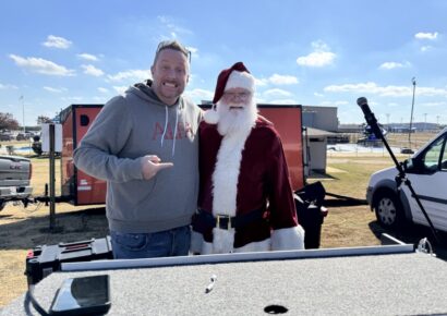 Hundreds gather to welcome skydiving Santa and Grinch