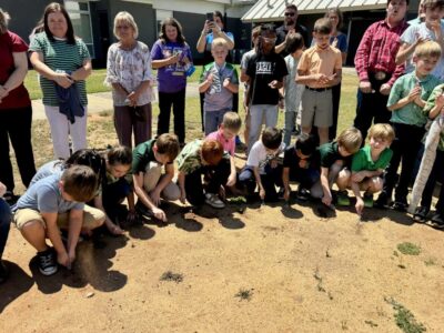 Victory Christian Academy students break ground on expansion project during last day of school